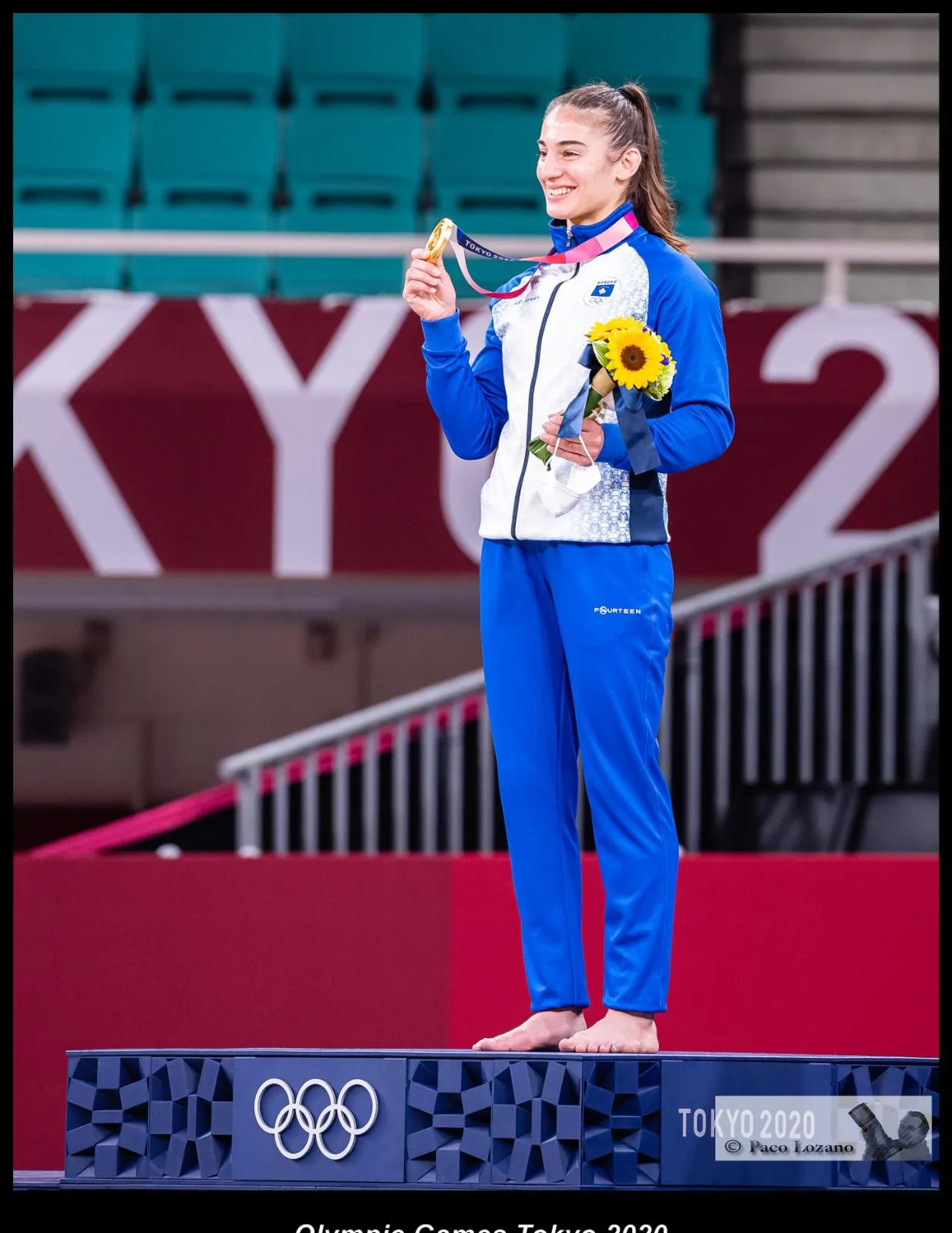 Nora with gold medal, close-up